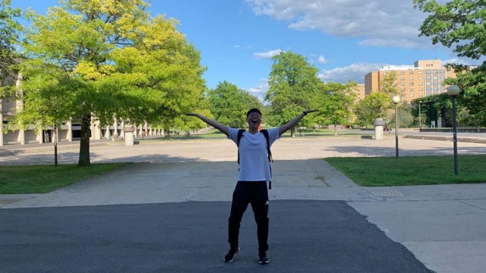 Johnson Liu, a junior computer science major from Brooklyn, shows his love for the campus