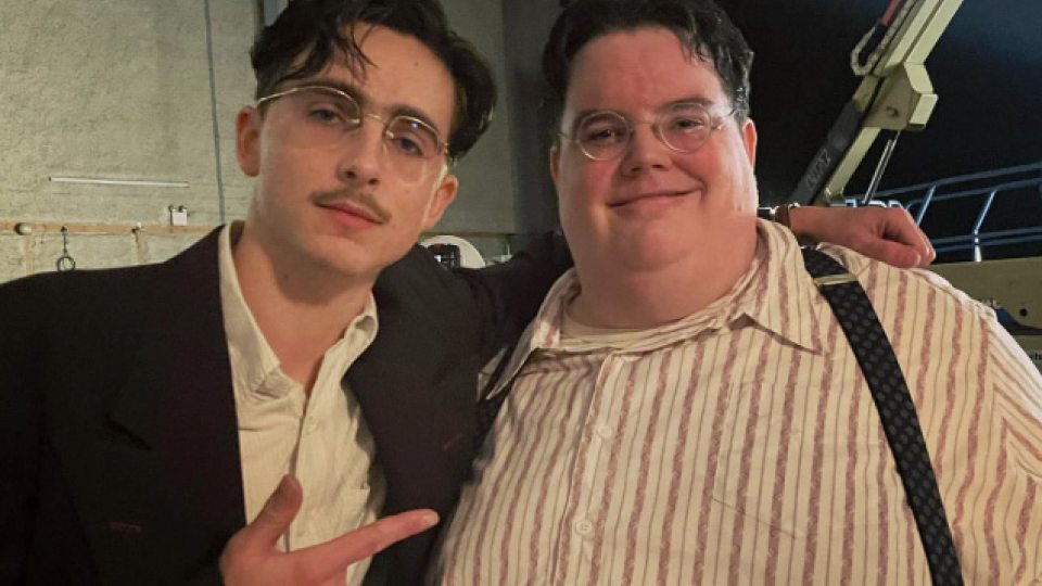 2015 alumnus Luke Manley (right) on the set of "Marty Supreme" with Timothee Chalamet