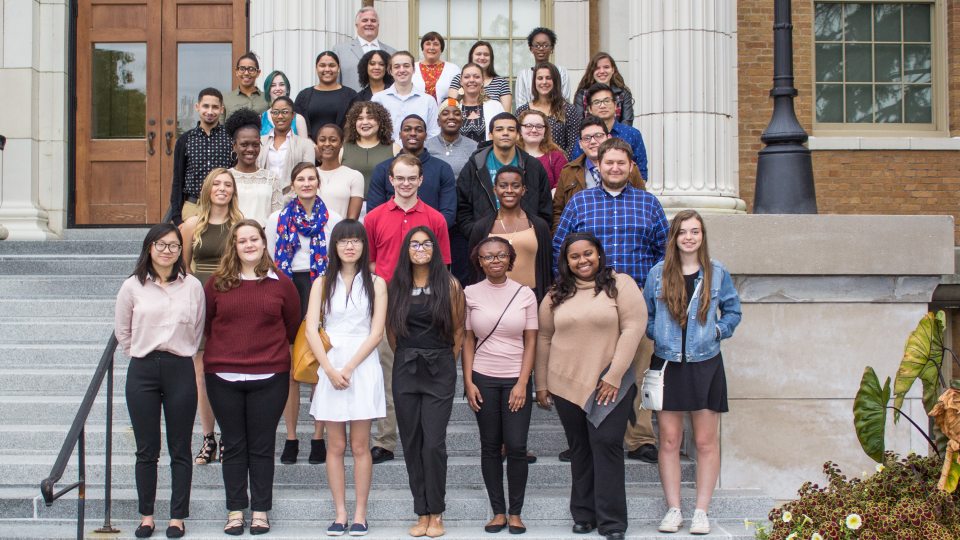 Students earning Marano Scholarships on steps of Sheldon Hall