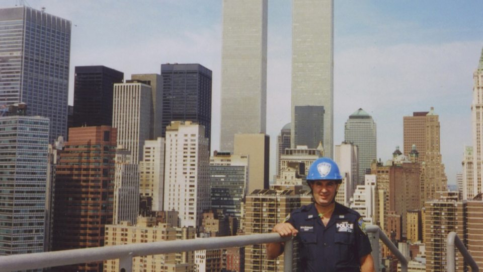 John McLoughlin in Port Authority Police Department uniform in front of the World Trade Center