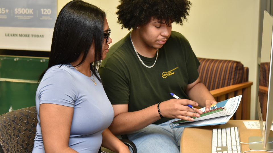 Rosely Paulino and Jeudin Alvarez are among the peer mentors in SUNY Oswego's new Money Matters financial literacy program.