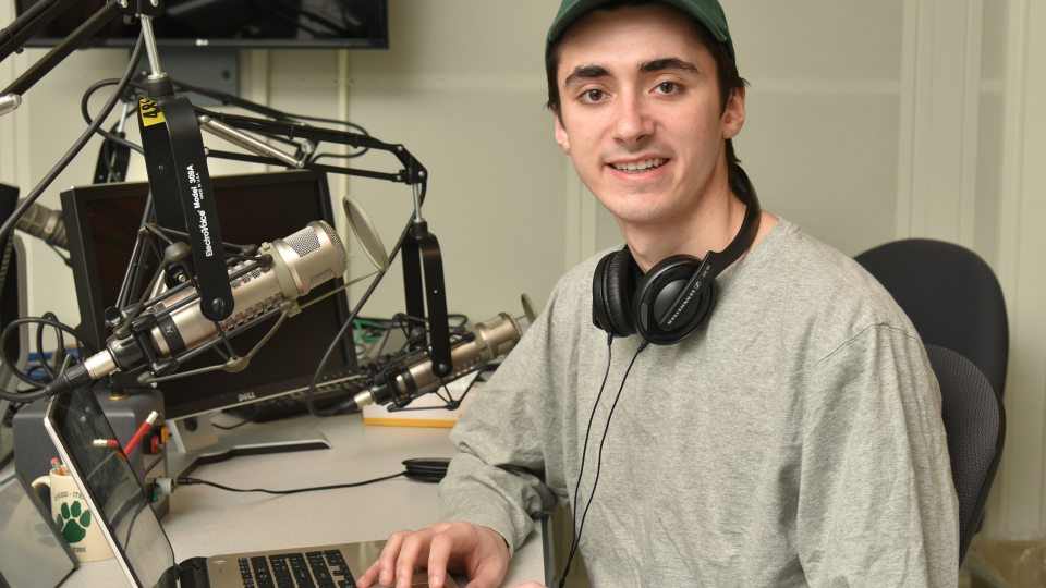 Snior journalism major Ryan Zalduondo in WRVO studios