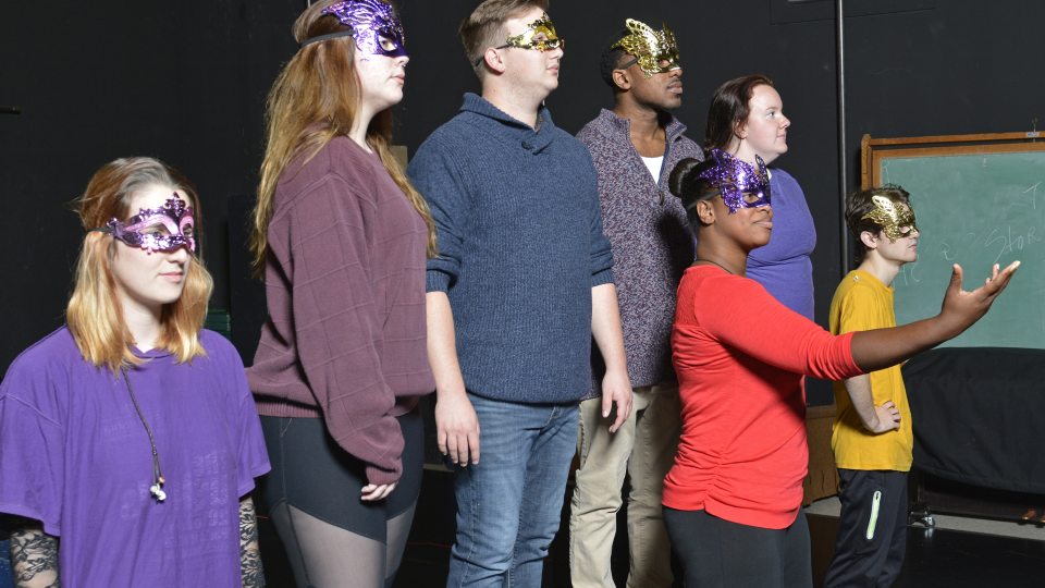 Students in "Acting Shakespeare" class in masks and rehearsing