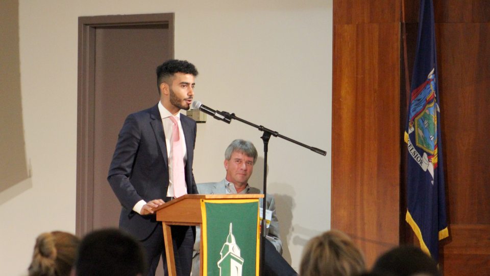Ahmed Albajari, at podium, was selected to speak on behalf of all scholarship students at the annual SUNY Oswego Scholars Breakfast