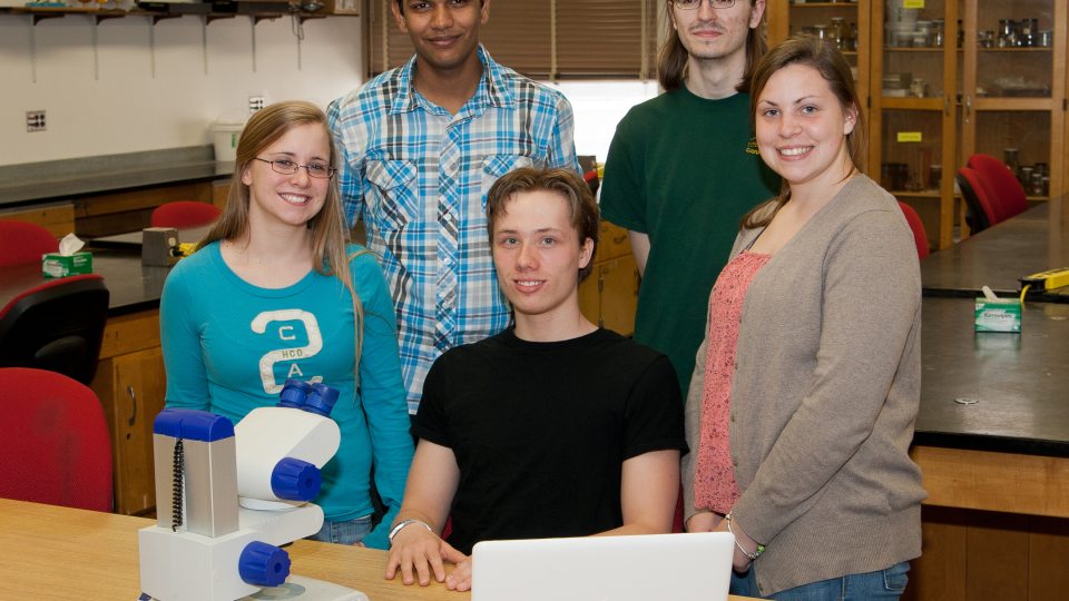 5 original Possibility Scholars in a lab