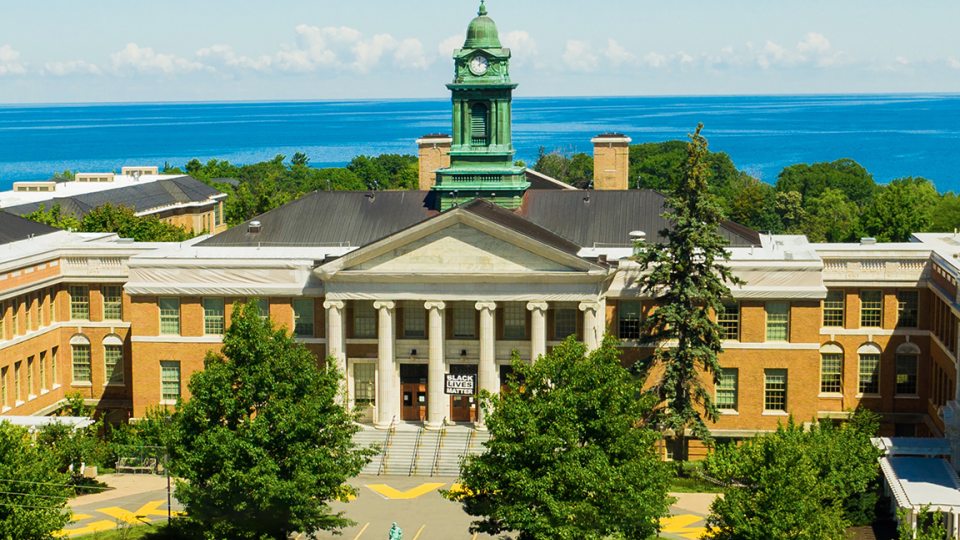SUNY Oswego's historic Sheldon Hall on the shores of Lake Ontario