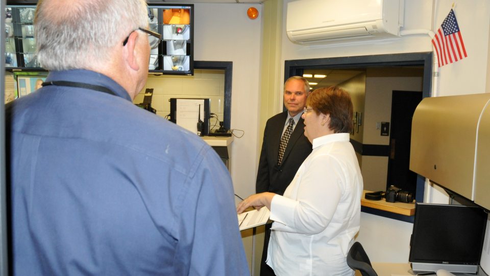 Staff from NOAA, emergency management and University Police discussing storm training