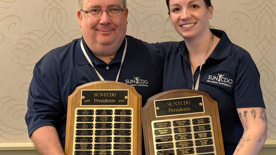 SUNY Oswego's Tina Phillips, left, and Chris Grow from Fredonia were past presidents of the SUNY Career Development Organizations and co-chairs of its 50th-anniversary event in early June 2026