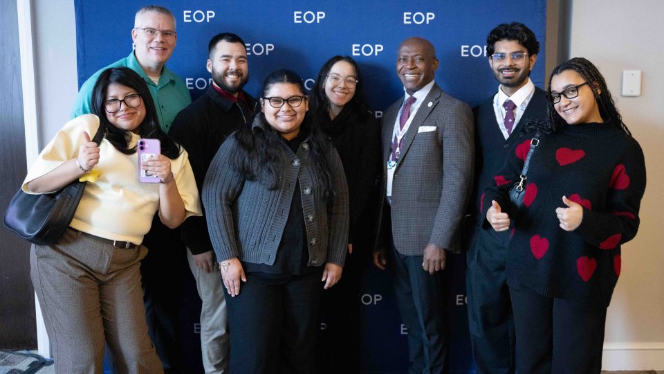 President Nwosu, joined by EOP students and staff, accept an EOP Champion Award