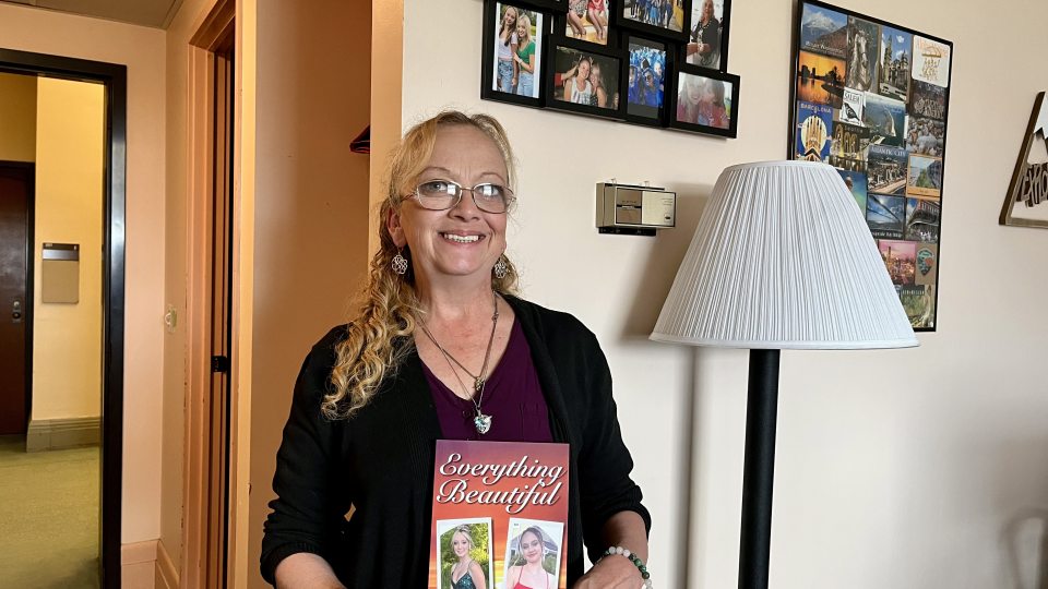 After losing both her daughters nearly two years ago in a car crash, Tina Trumble, whose day job is serving students in the Financial Aid Office, has written a book, “Everything Beautiful,” to help others heal and raise money for a scholarship.