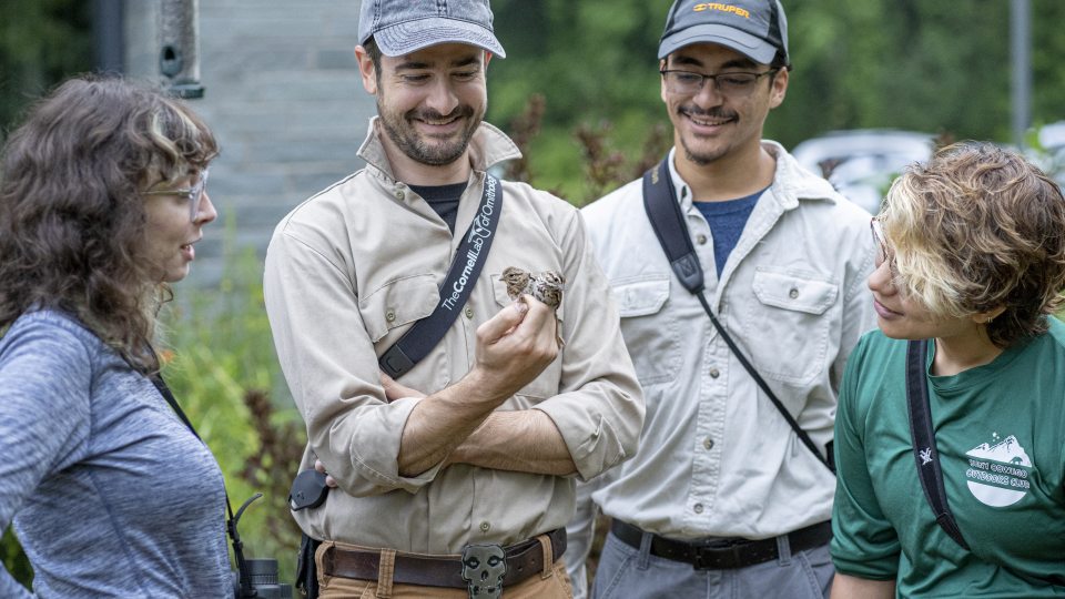 Biological sciences faculty member Daniel Baldassarre and his research students at Rice Creek observing birds