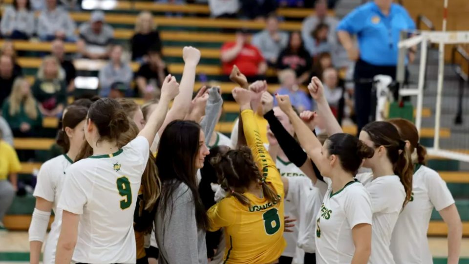 Women's volleyball team huddles up
