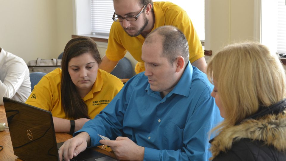 Students helping prepare taxes