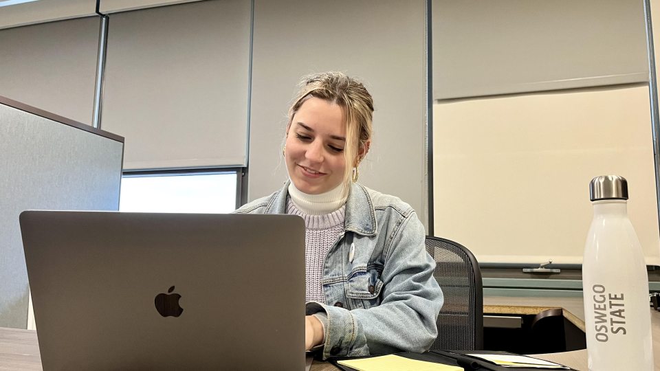 Student studying on a laptop