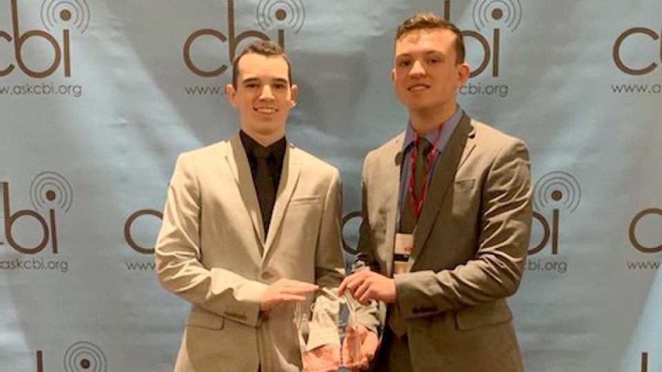 WNYO representatives Mark Rowlands and Ben Grimaudo accept first-place CBI award for Best Sports Play-By-Play