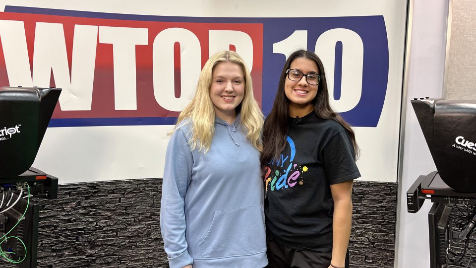 Co-producers Natalie Barden (left) and Jolie Santiago (right) stand in the WTOP studio ahead of the first ever all-female WTOP sports broadcast.