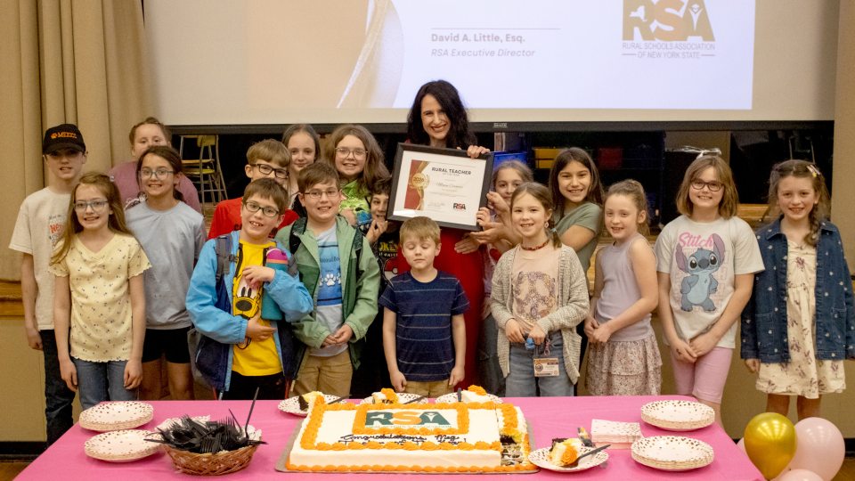 Megan Thomson Cernaro with children accepting the award for Rural Teacher of the Year