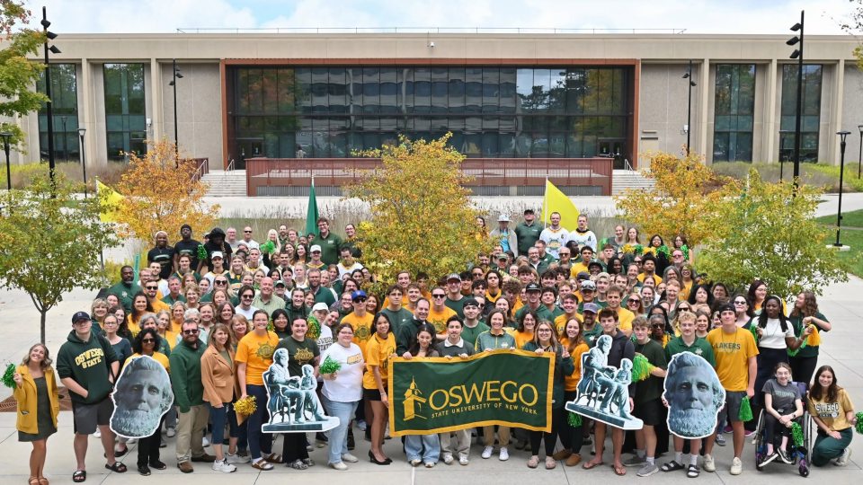 Many Lakers wearing green and gold