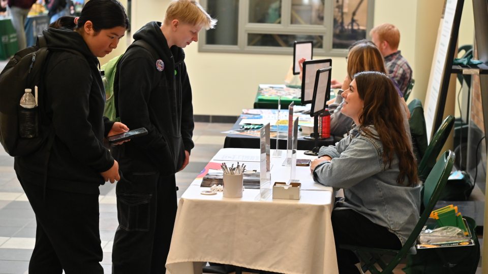 Students visit the ARTSwego table at a previous Campus Opportunities Expo