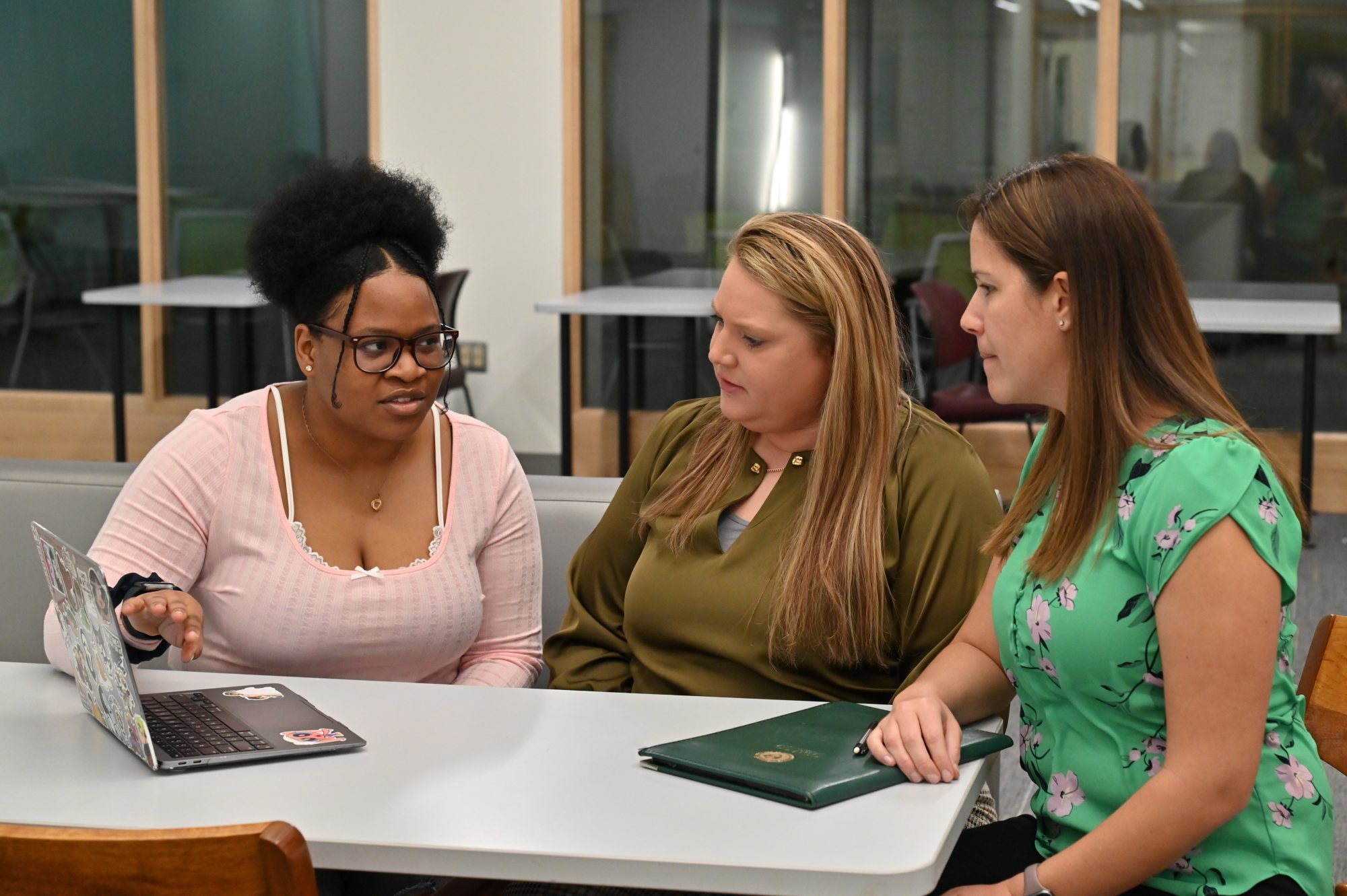 Gabriella Patterson, a double major in wellness management and psychology, works on her Quest project with health promotion and wellness faculty members and mentors Jessica Harris and Elizabeth Kieda