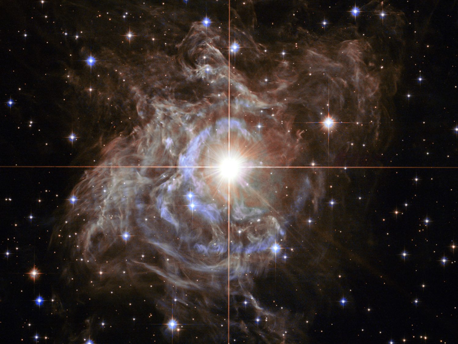 Scientists including SUNY Oswego's Shashi Kanbur use cepheid variable stars like the pulsating RS Puppis (pictured in this NASA image) to try to calculate the size of the universe.