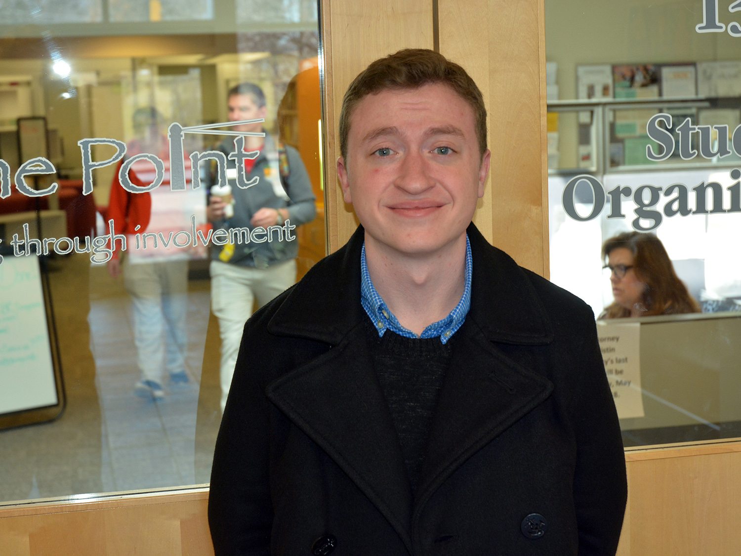 Conner Breeze stands outside The Point, the student involvement hub