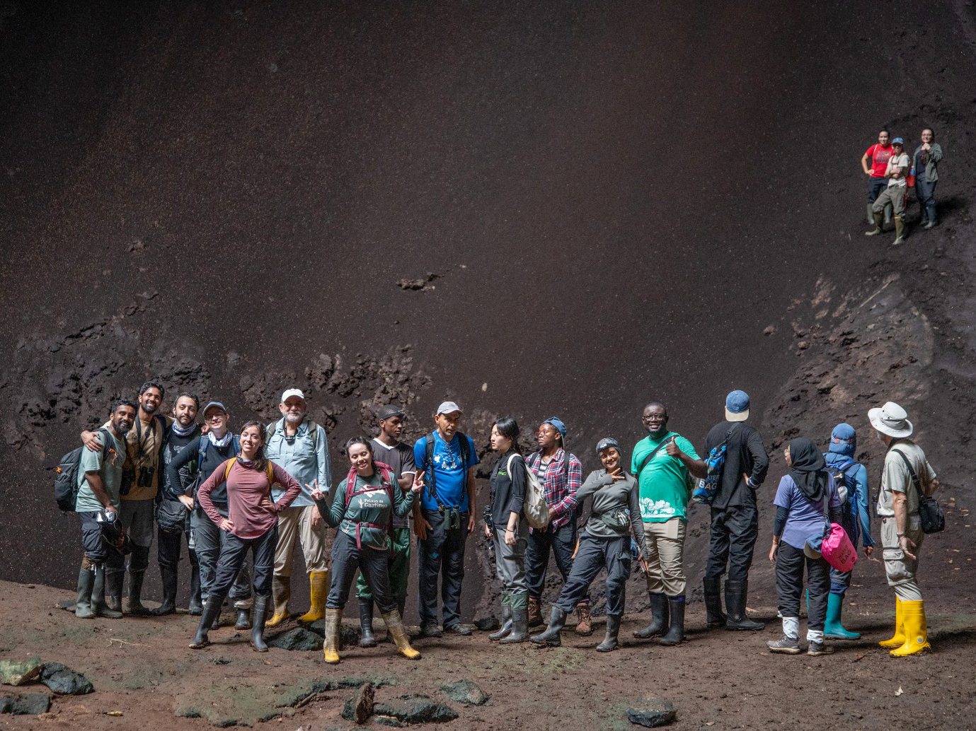 Bat researchers exploring a cave as part of the inaugural Global South workshop