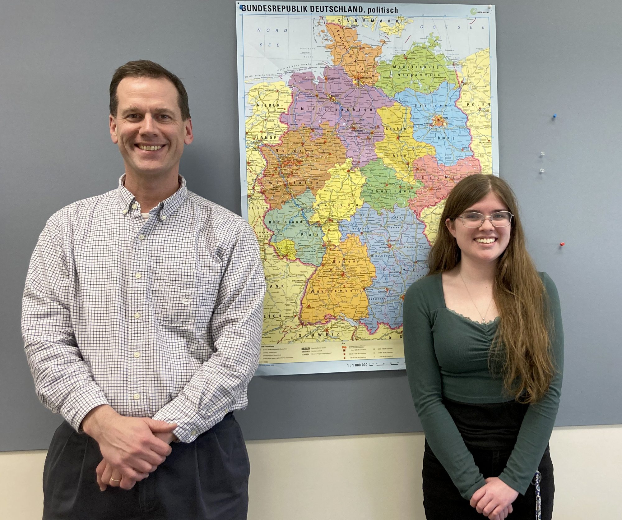 Patrick Schultz of the Modern Languages and Literatures Department congratulates SUNY Oswego student Marie Parker on receiving a German Academic Exchange Service (Deutscher Akademischer Austauschdienst, or DAAD) grant to study this summer in Germany.