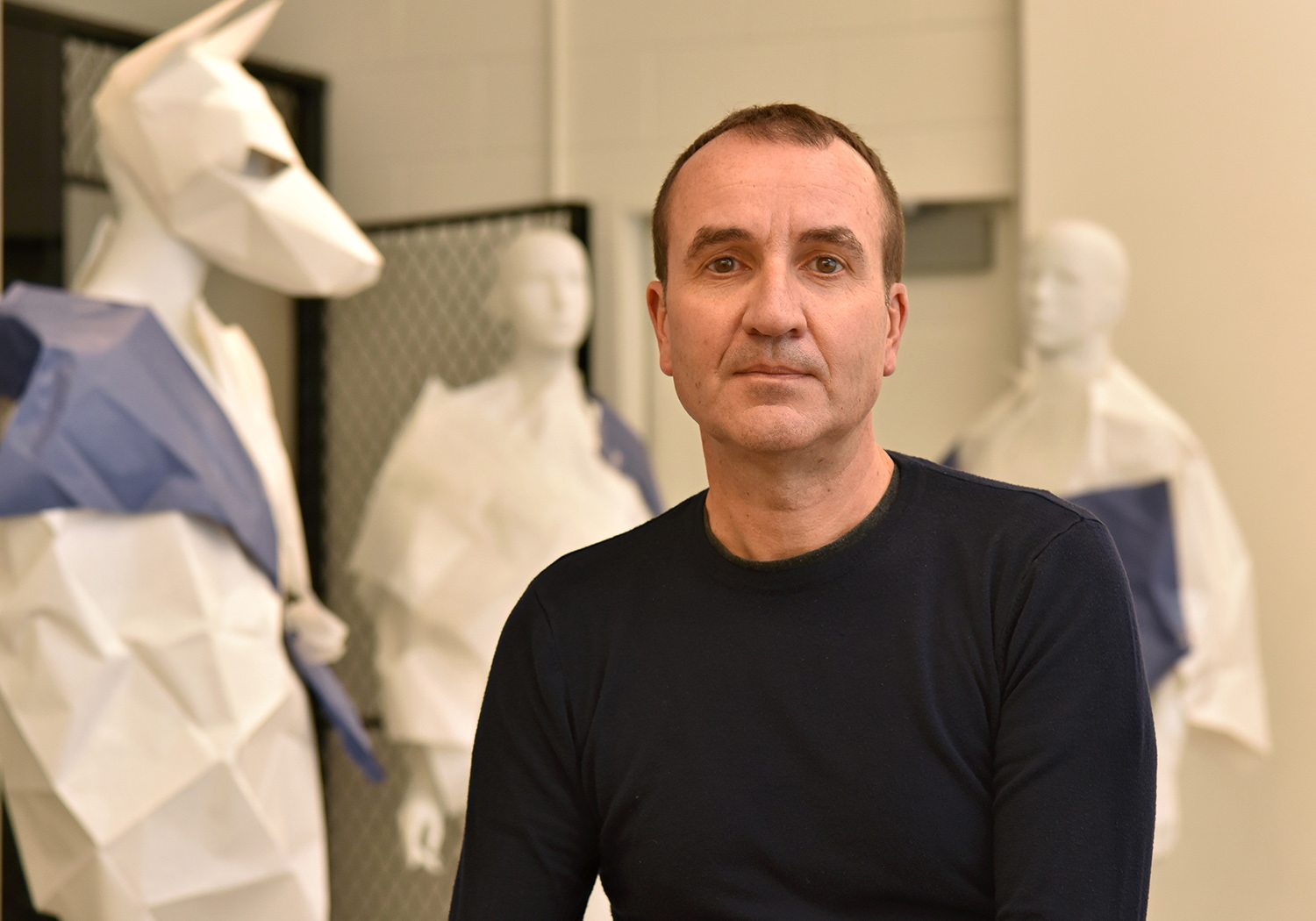 Juan Perdiguero surrounded by creations in his art studio