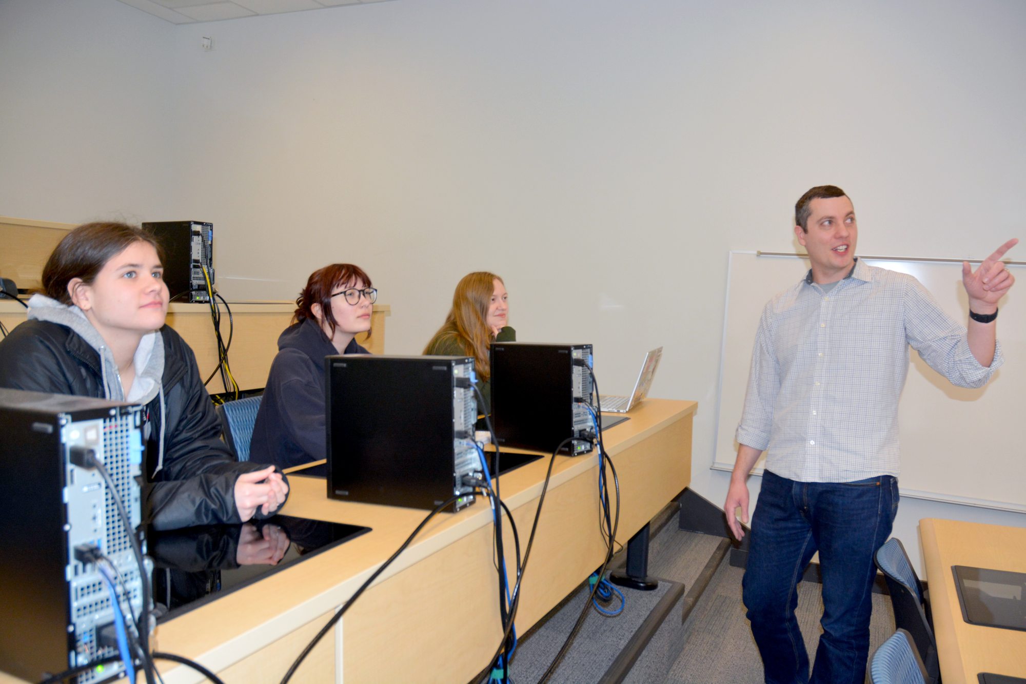 Mark Baker speaks to students in a statistics class