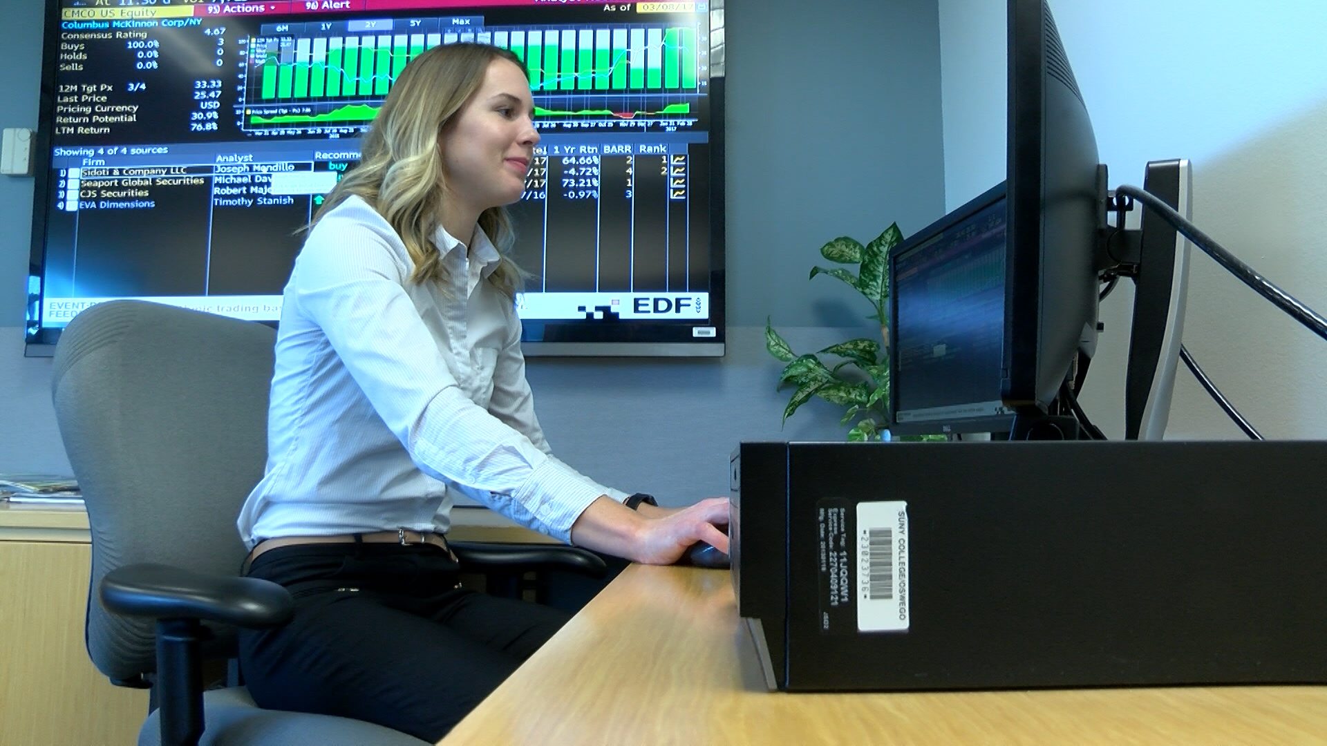 Abigail Boyce using Bloomberg terminal to research stocks
