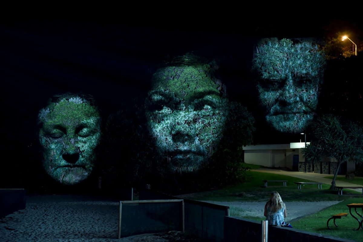 Project visual art of three faces by Craig Walsh at a previous installation in Australia