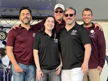 Members of DKK and the CAC gather during DKK’s Centennial and fundraiser benefiting the CAC, from left: James Lalino '10, Abbey Nettle, Pat Magin '91, Tory DeCaire '96 and Thomas DiRoma '11.