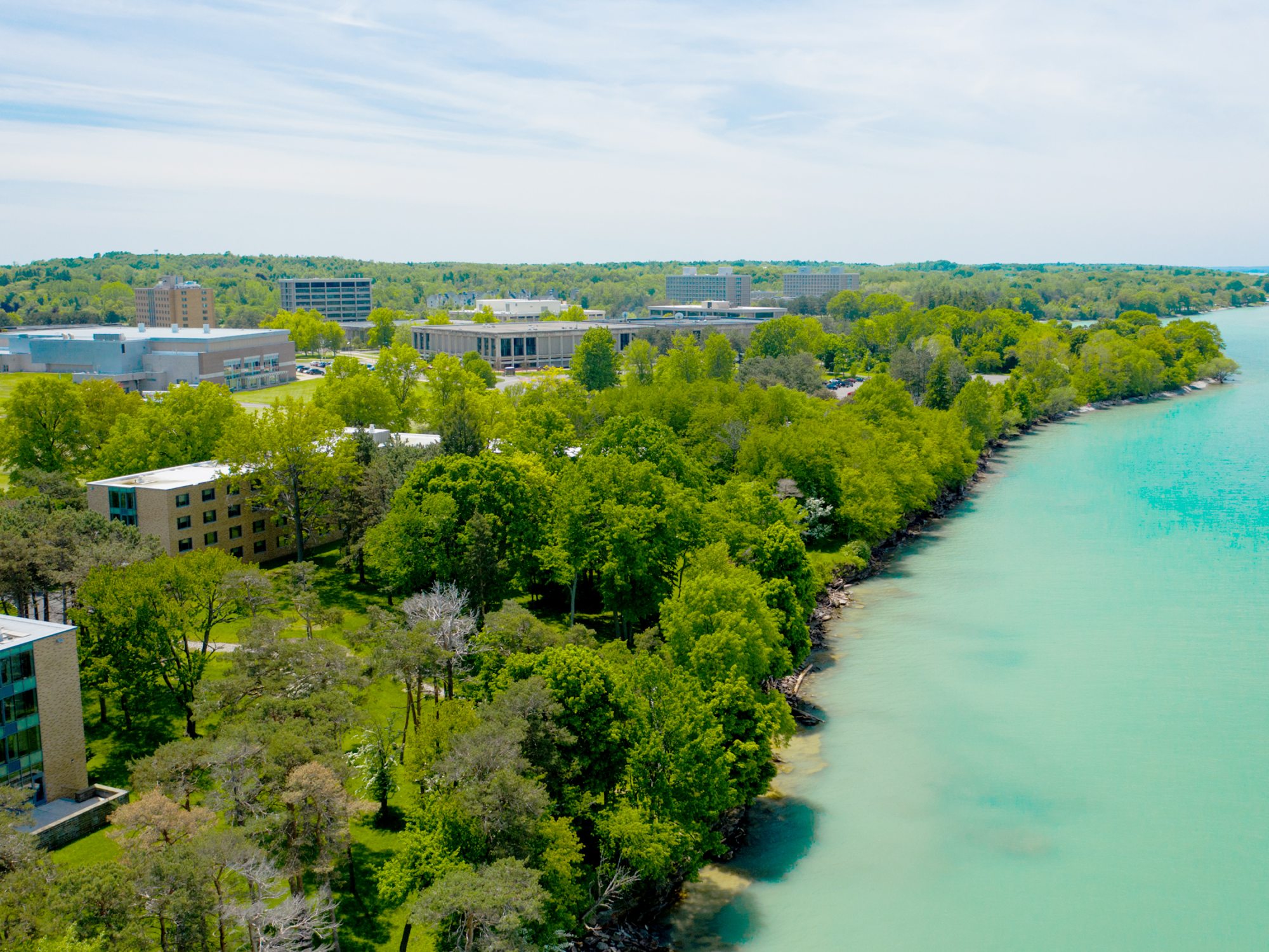 Aerial view of Lake Ontario and campus buildings