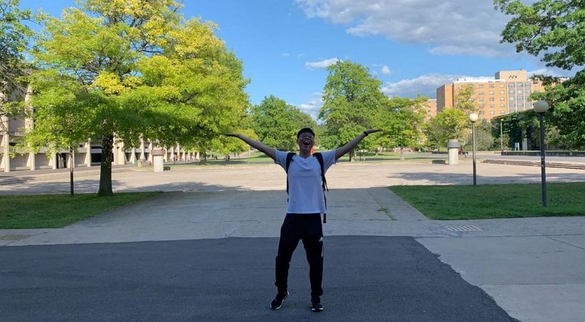 Johnson Liu, a junior computer science major from Brooklyn, shows his love for the campus