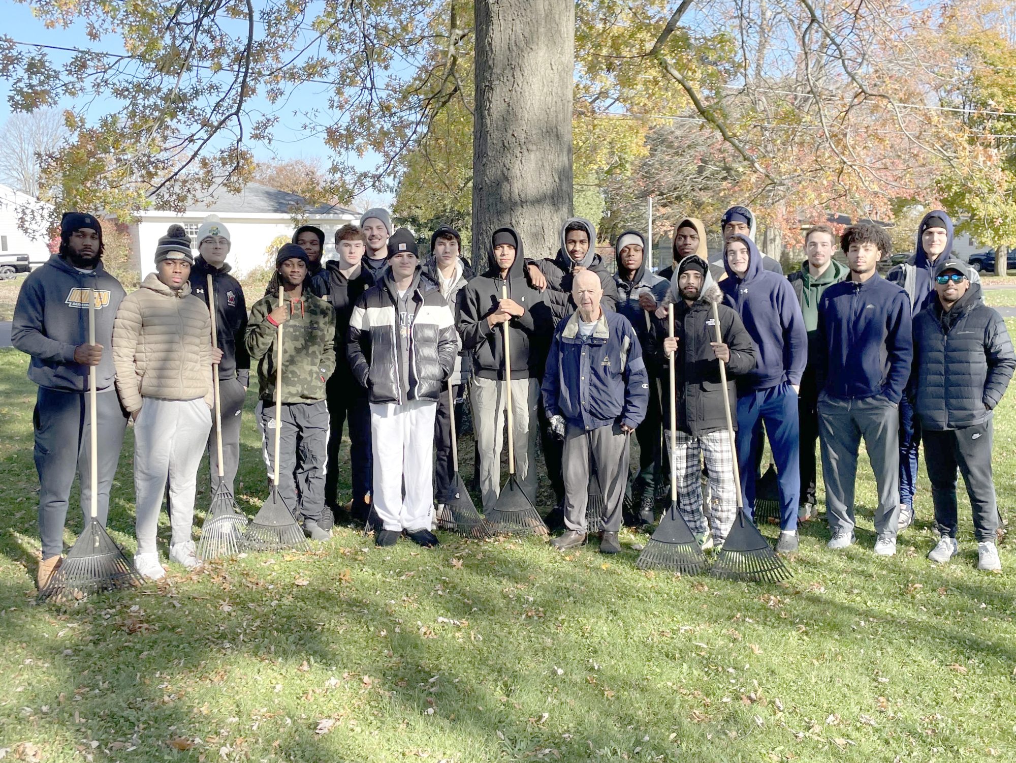 The Laker men's basketball team were among the hundreds of SUNY Oswego student-athletes raking yards for local senior citizens
