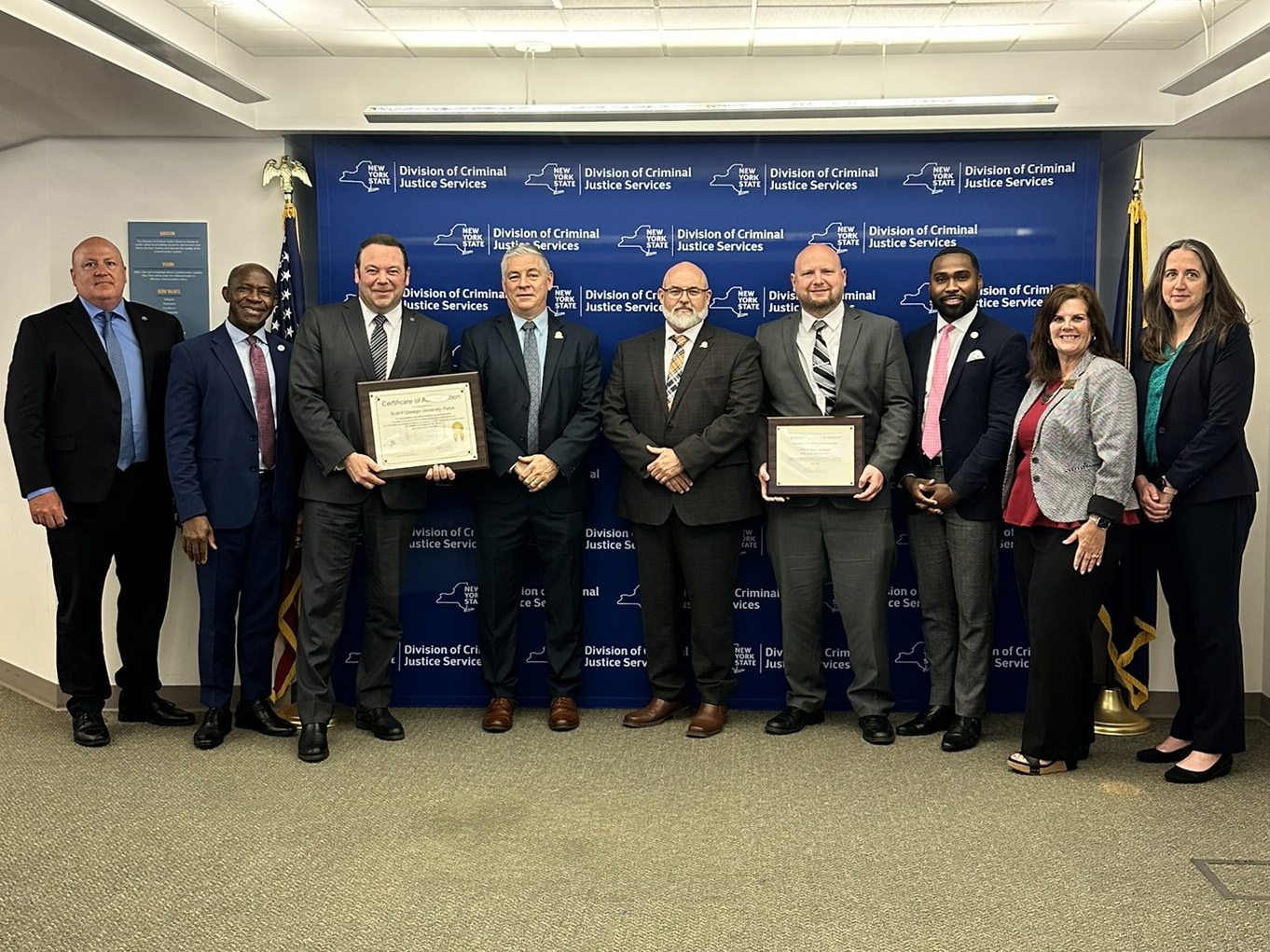 State and SUNY Oswego official celebrate University Police's recent accreditation