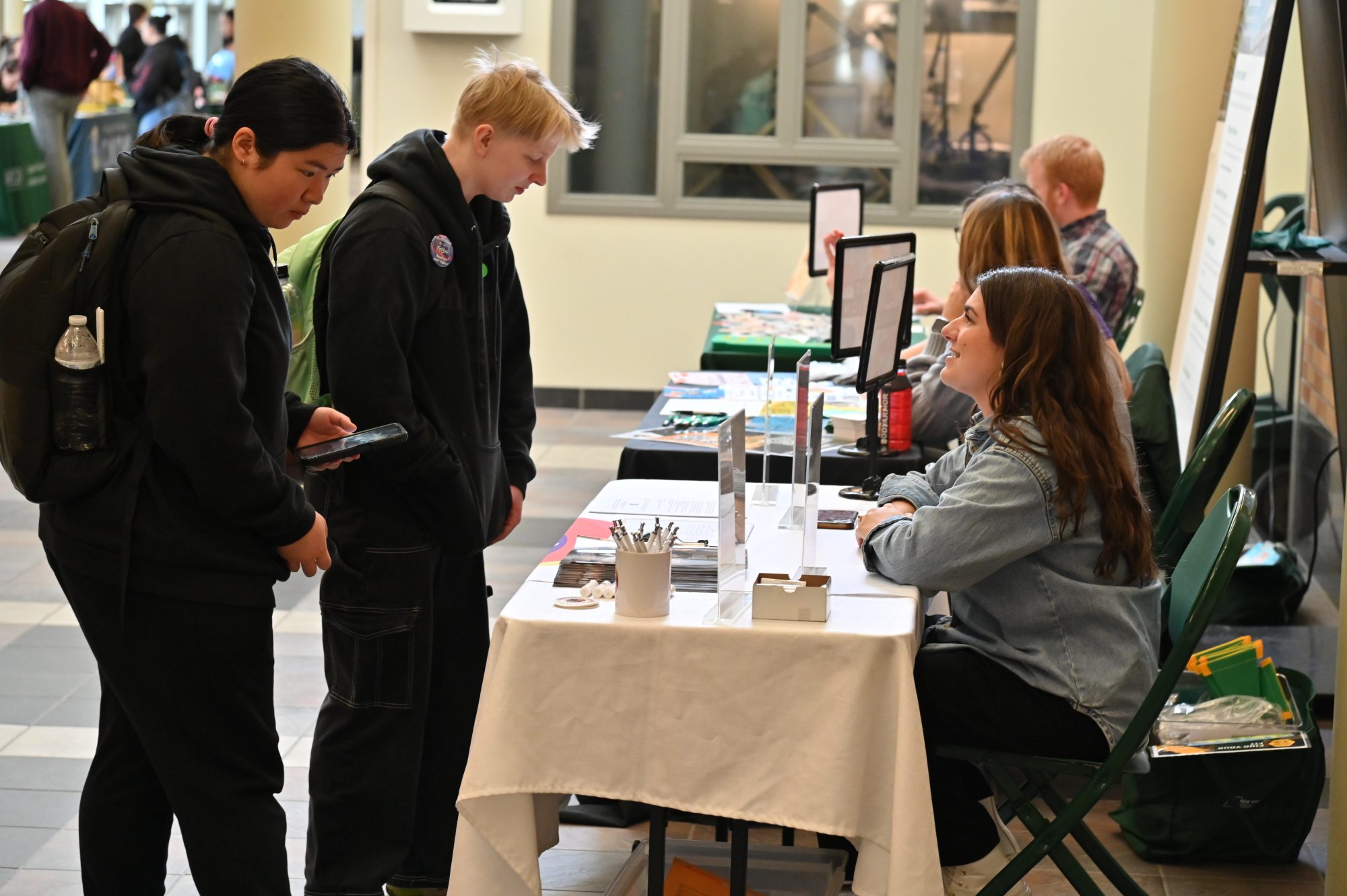 Students visit the ARTSwego table at a previous Campus Opportunities Expo