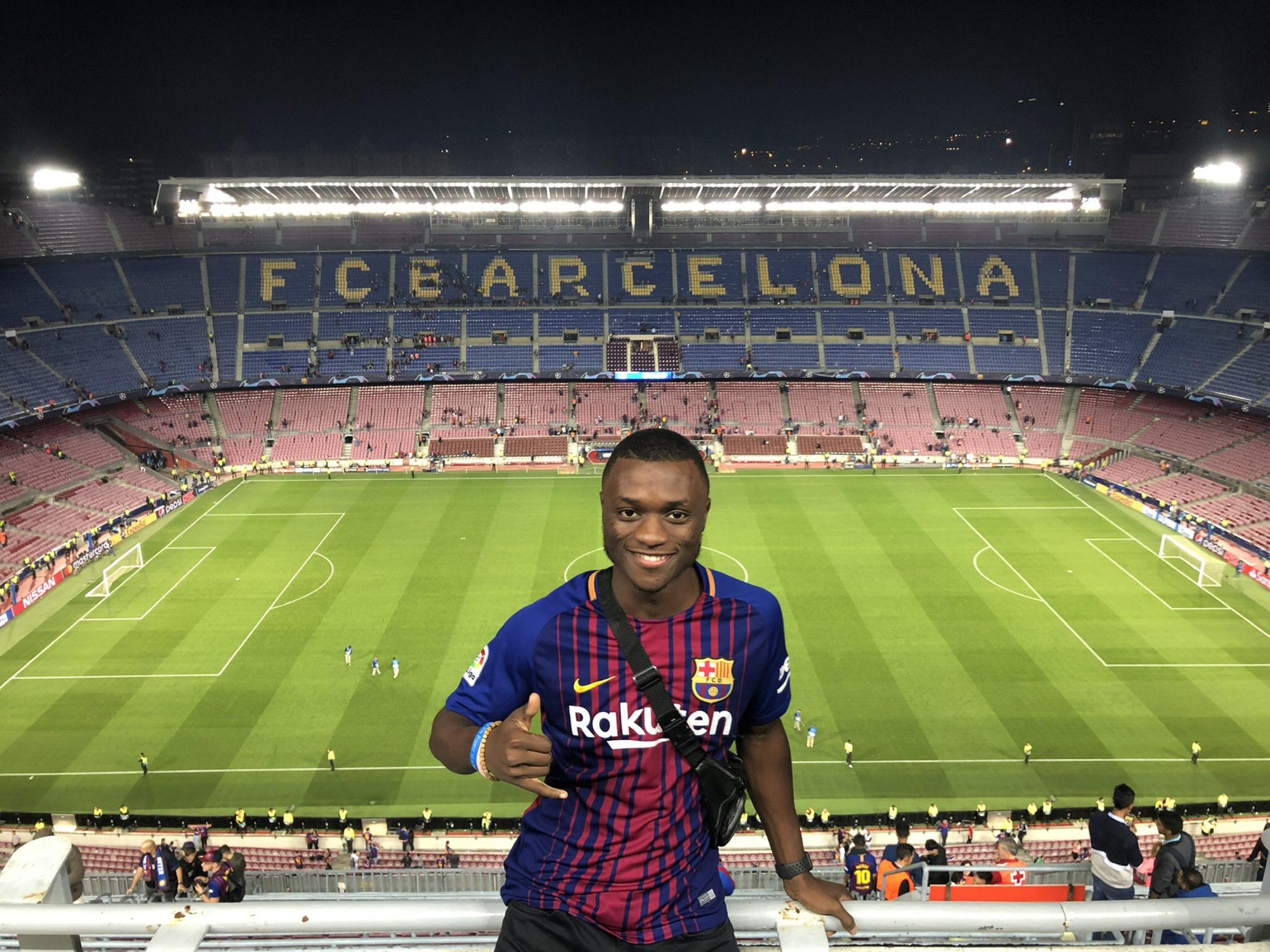 SUNY Oswego senior technology management major and former Laker soccer player Nyezee Goe, shown here taking in an FC Barcelona game in Spain, is one of many students who have explored the world through SUNY Oswego