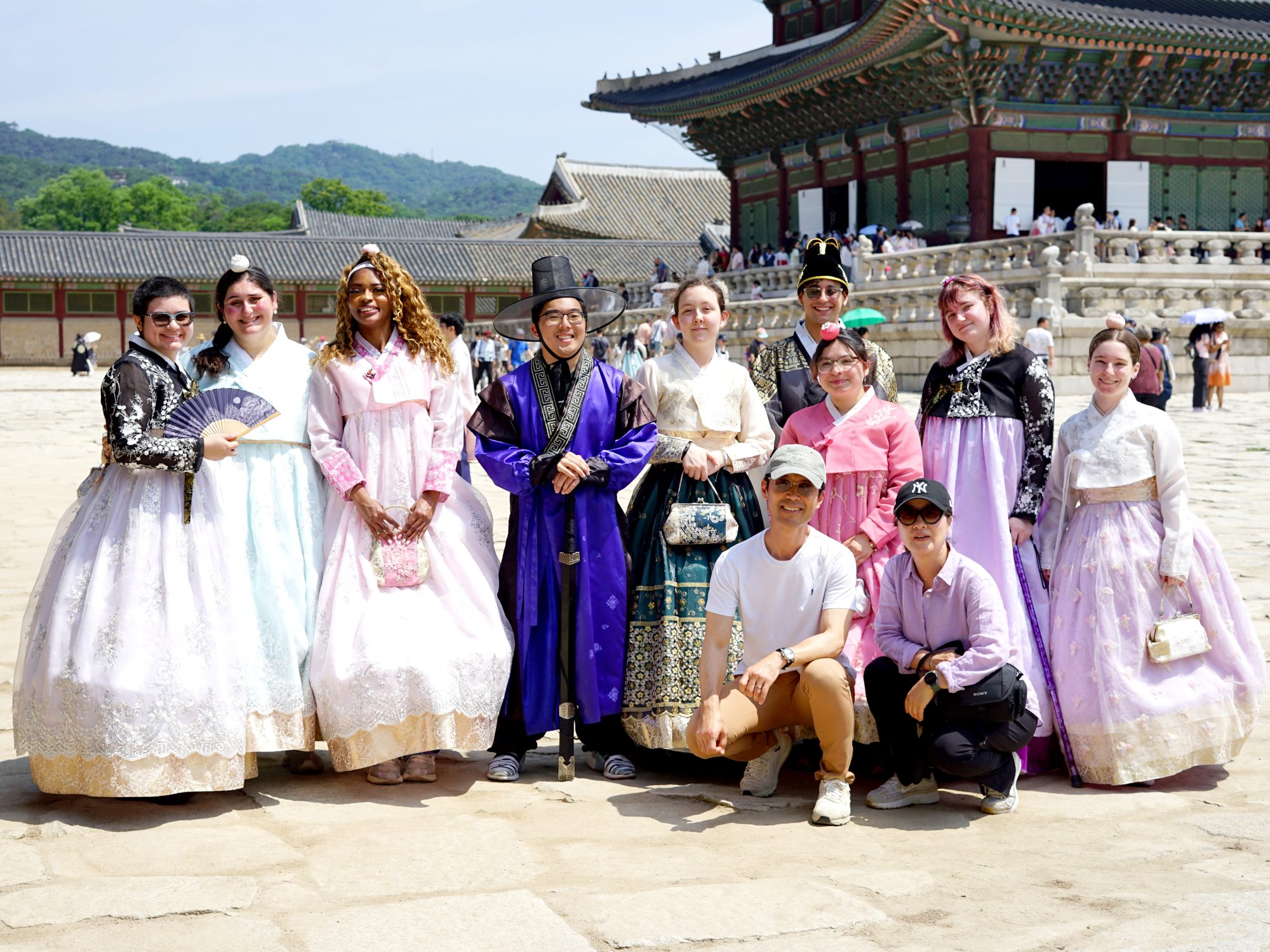 Micah Shahoud and other students from SUNY Oswego's Q4 South Korea “Korean Wave and Media” try some traditional Korean outfits