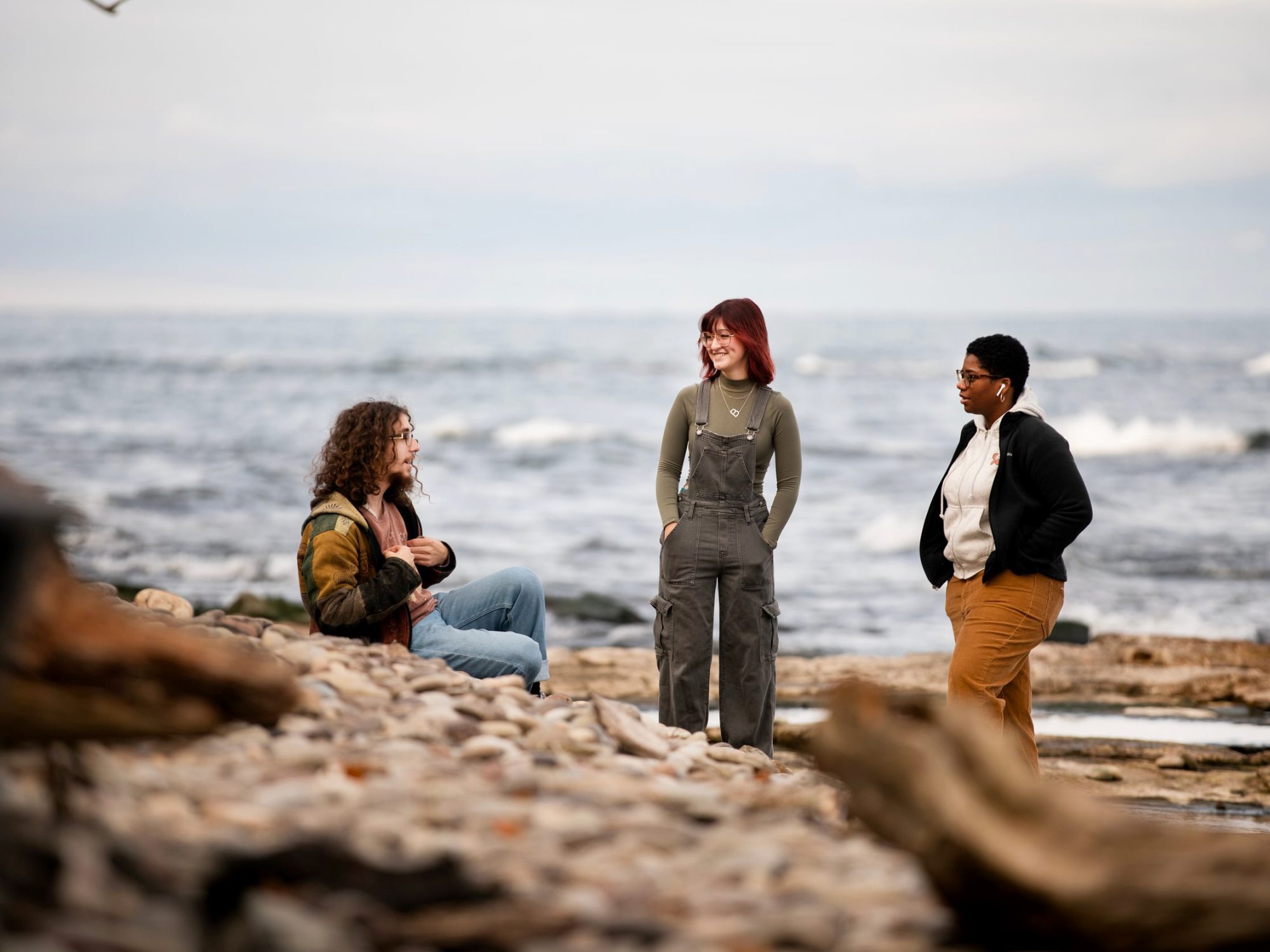 Students talk next to Lake Ontario