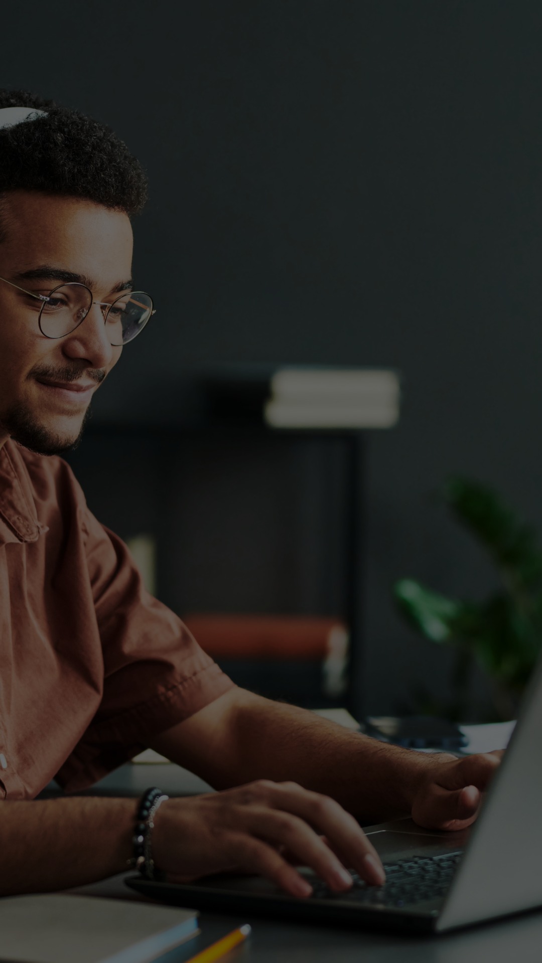 A male student learns online. 