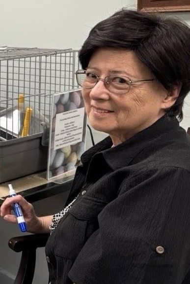 Maria Nakamura holding a marker and smiling