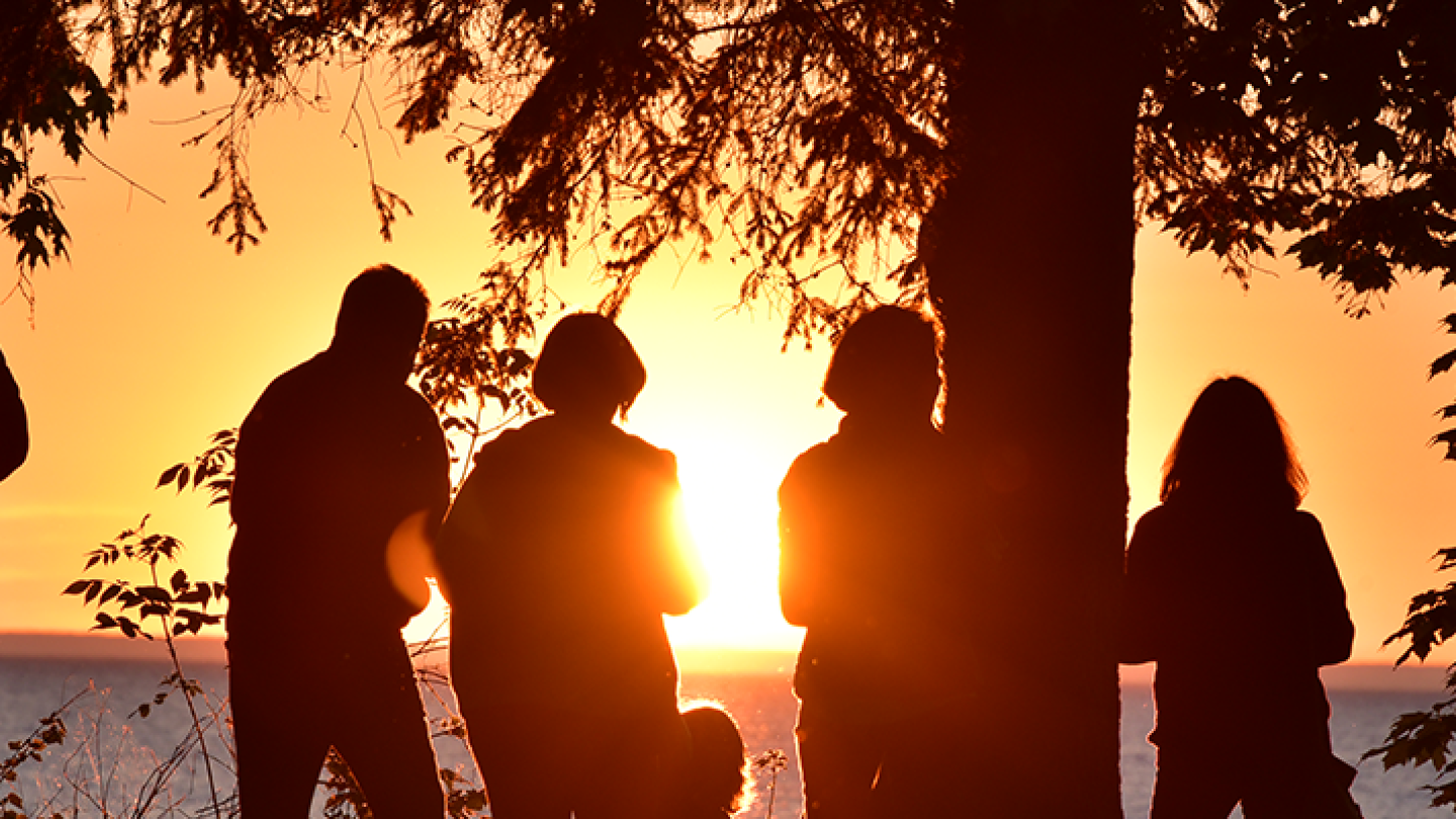 People watching one of Oswego&#039;s famous sunsets