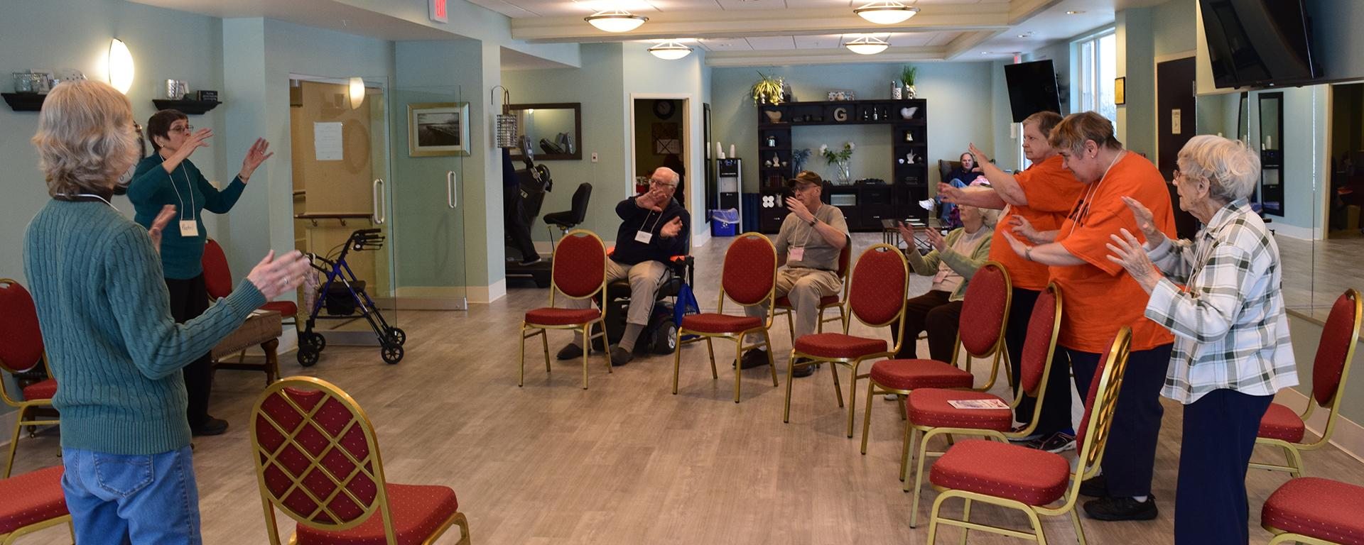 Instructing a group of older adults to exercise their hands