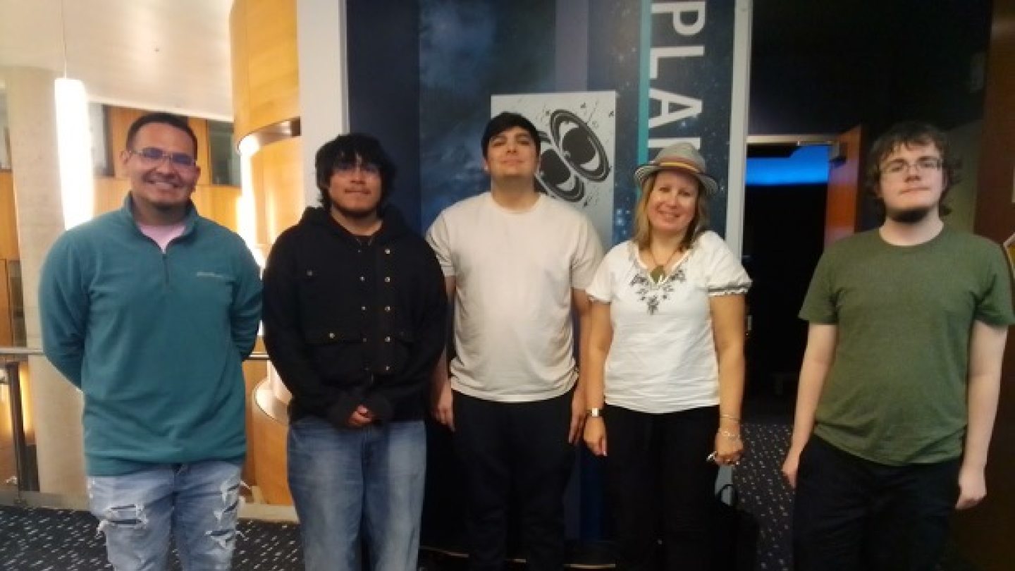 Students pose outside the Shineman Planetarium