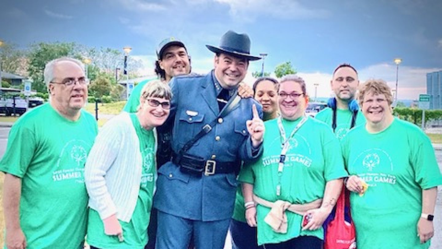 Chief Swayze posing with a group of Special Olympics participants