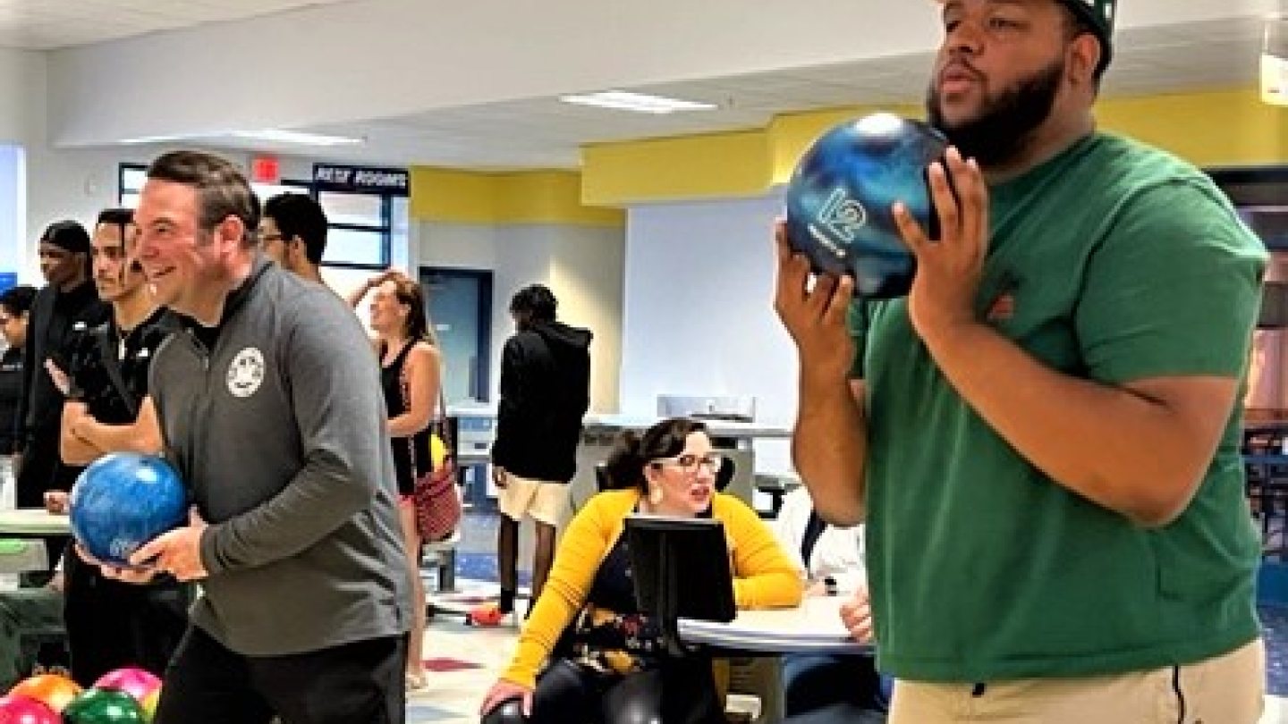 Chief Swayze and a community member bowling