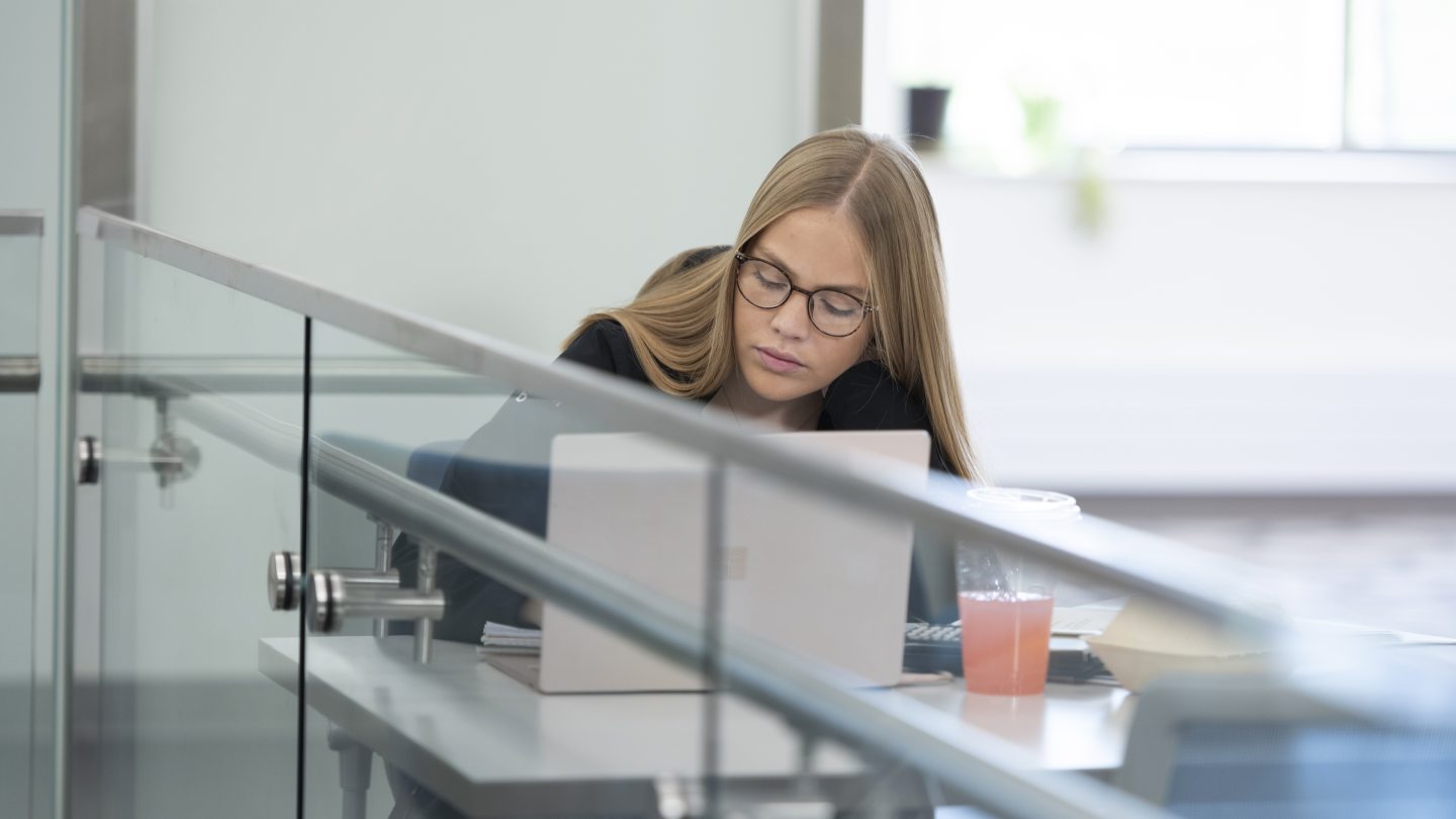student studying by herself on a laptop