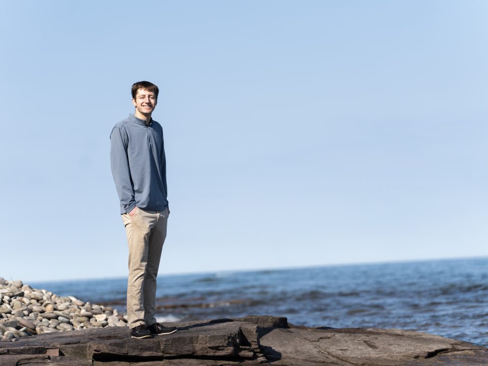 headshot of student by the lake